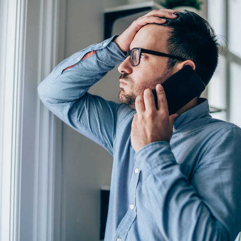 man receiving phone call that someone has been in an accident in his car