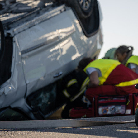 paramedics helping car accident victim